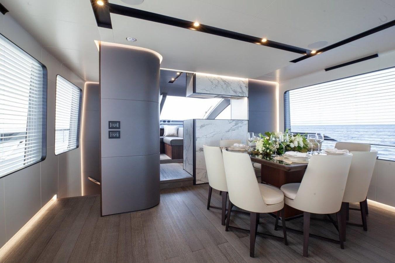 a room with a table and chairs aboard 2021 ASTONDOA AS8 Yacht for Sale