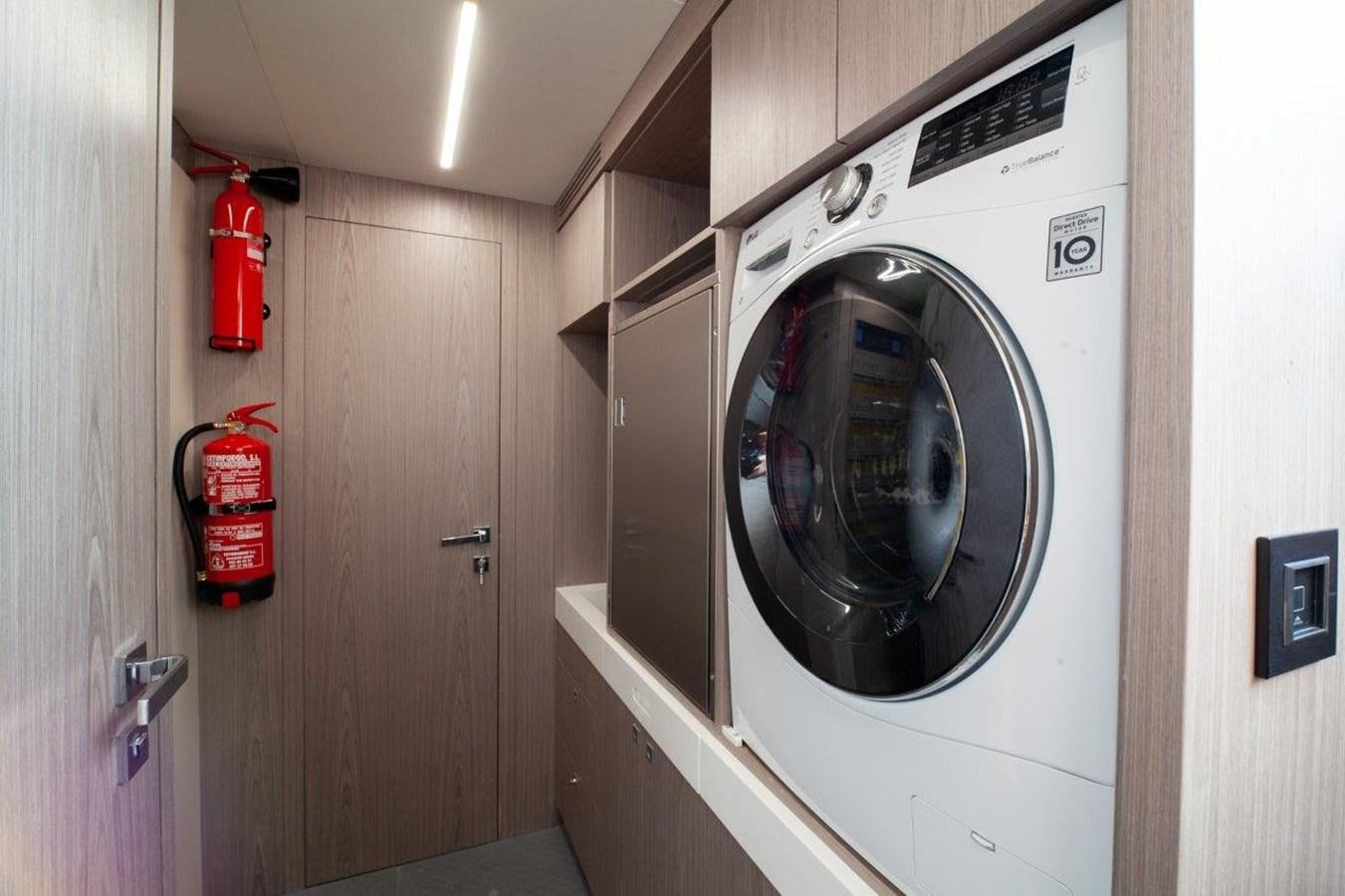 a washing machine in a room aboard 2021 ASTONDOA AS8 Yacht for Sale