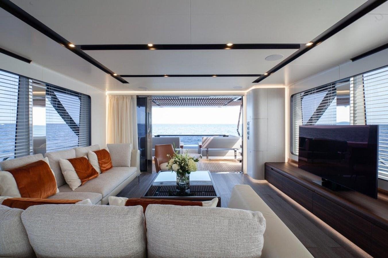 a living room with a large window aboard 2021 ASTONDOA AS8 Yacht for Sale