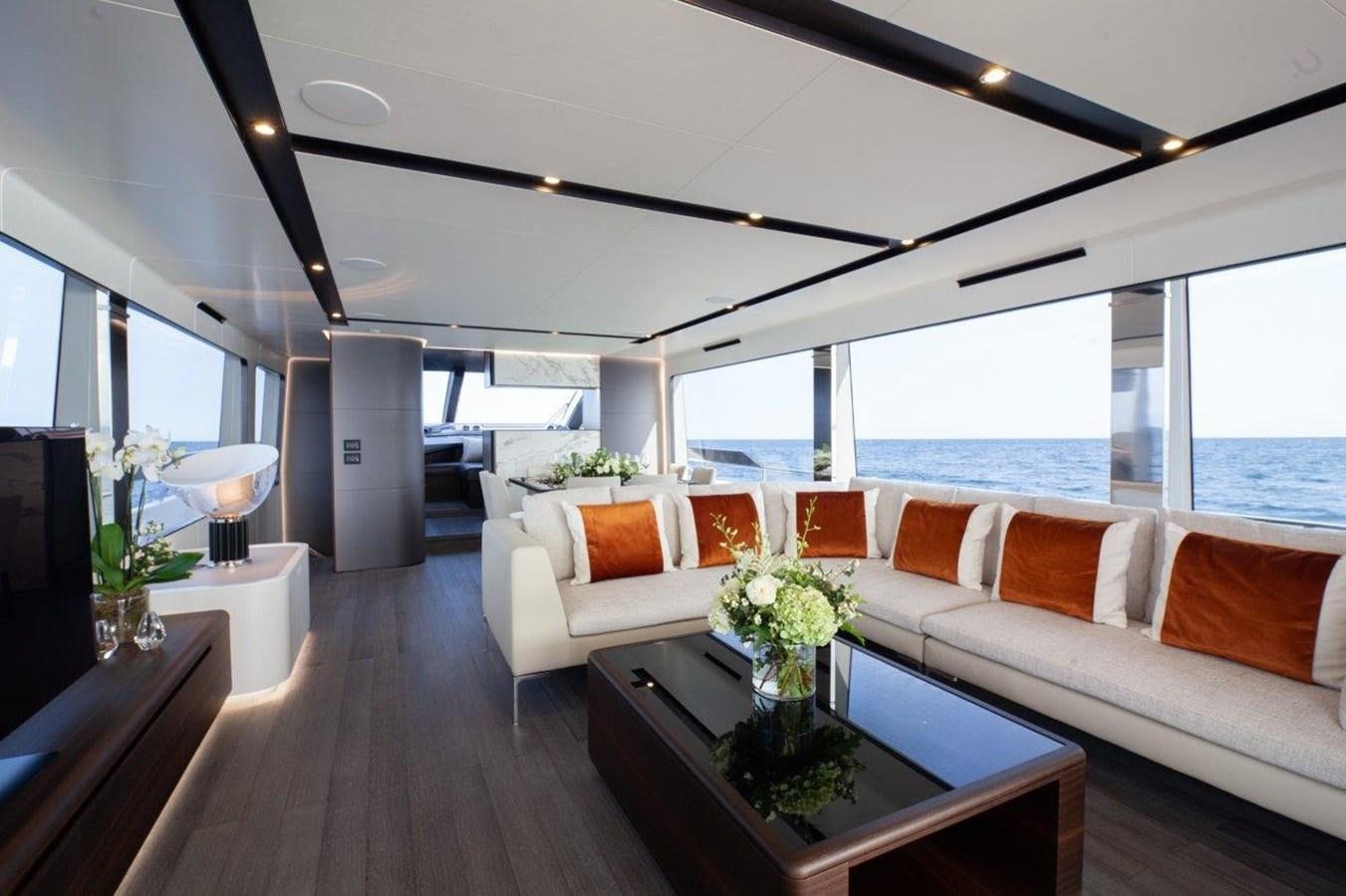 a living room with a large window aboard 2021 ASTONDOA AS8 Yacht for Sale