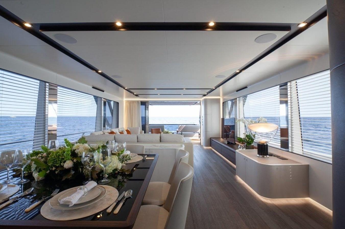 a room with a table and chairs aboard 2021 ASTONDOA AS8 Yacht for Sale