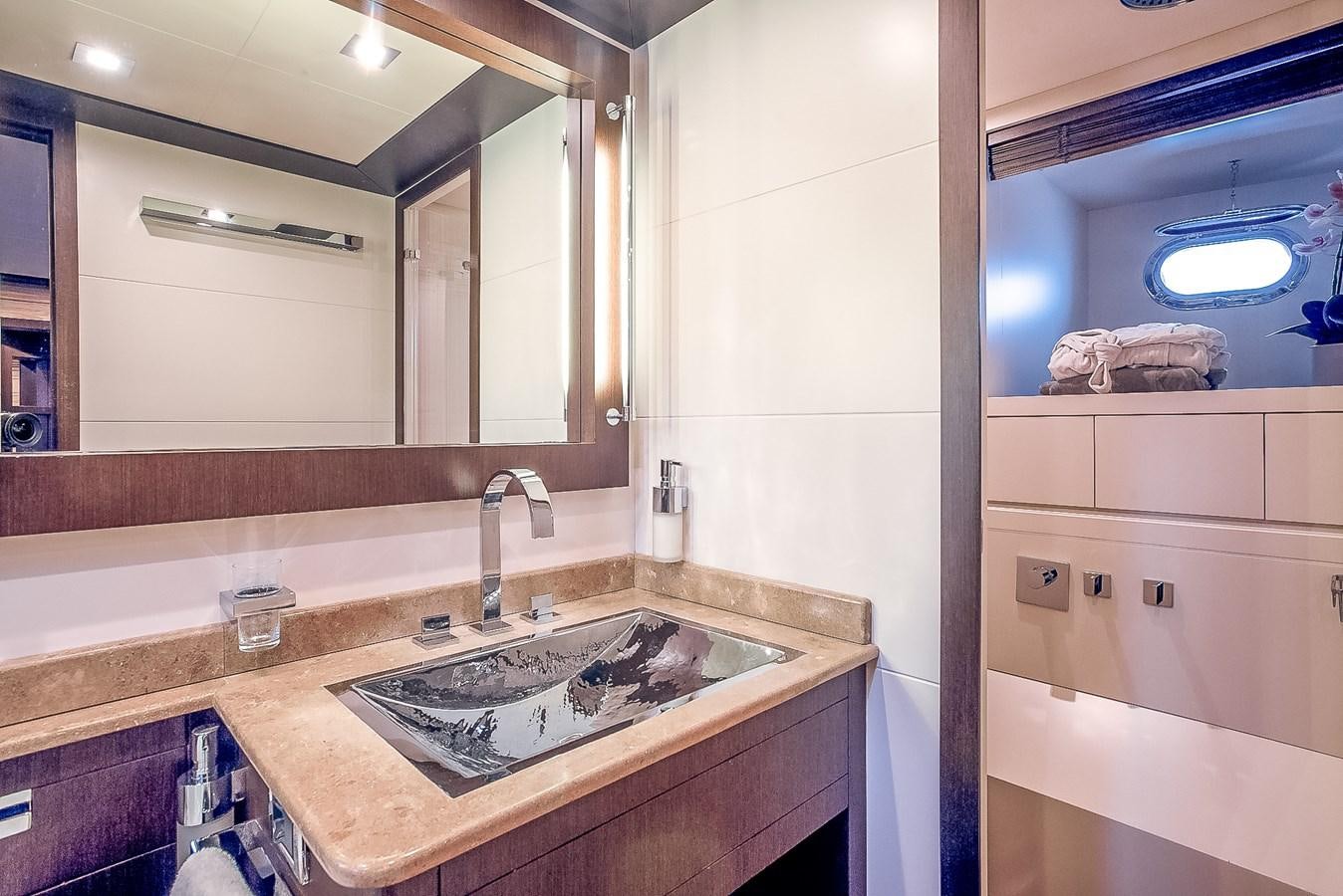 a bathroom with a sink and a mirror aboard MILU II Yacht for Sale