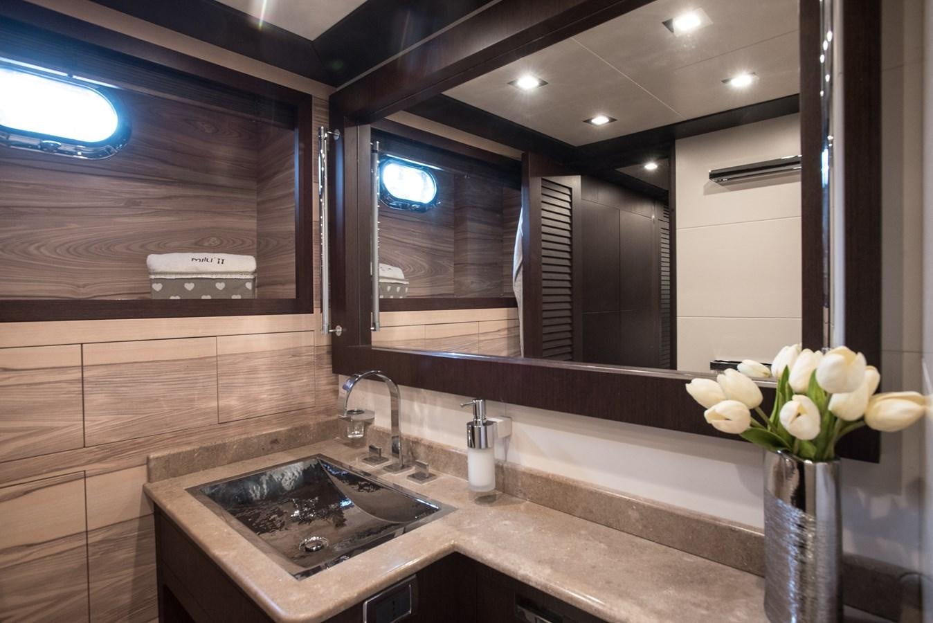 a bathroom with a sink and a mirror aboard MILU II Yacht for Sale