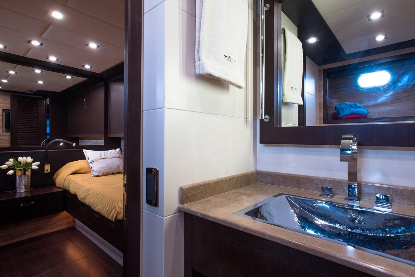 a bathroom with a sink and a bed aboard MILU II Yacht for Sale