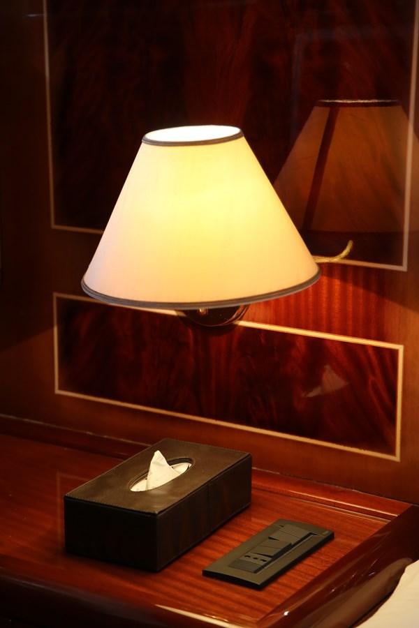 a lamp on a table aboard EL VIP ONE Yacht for Sale