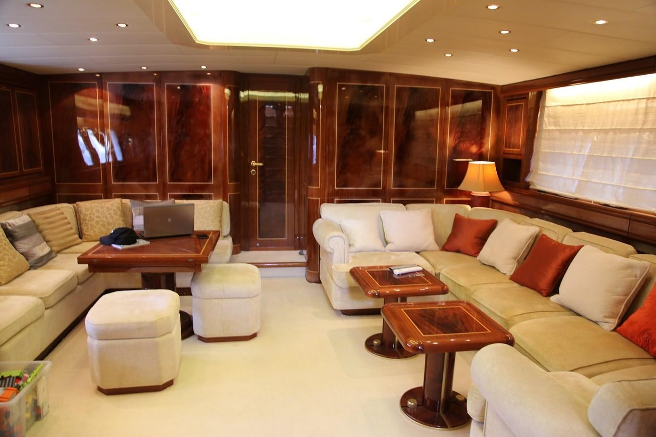 a living room with a couch and a table aboard EL VIP ONE Yacht for Sale