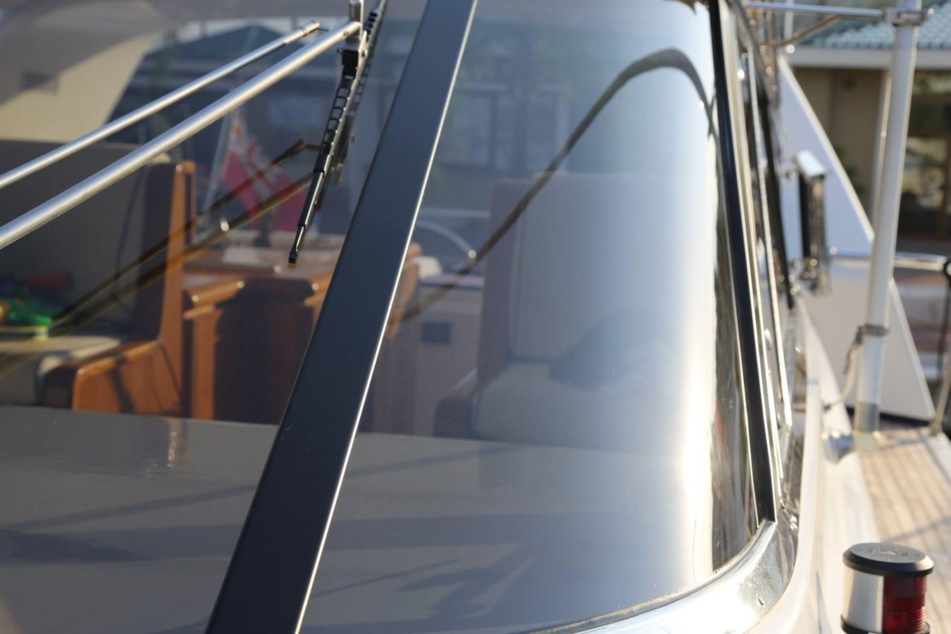 a close-up of a car's side mirror aboard EL VIP ONE Yacht for Sale