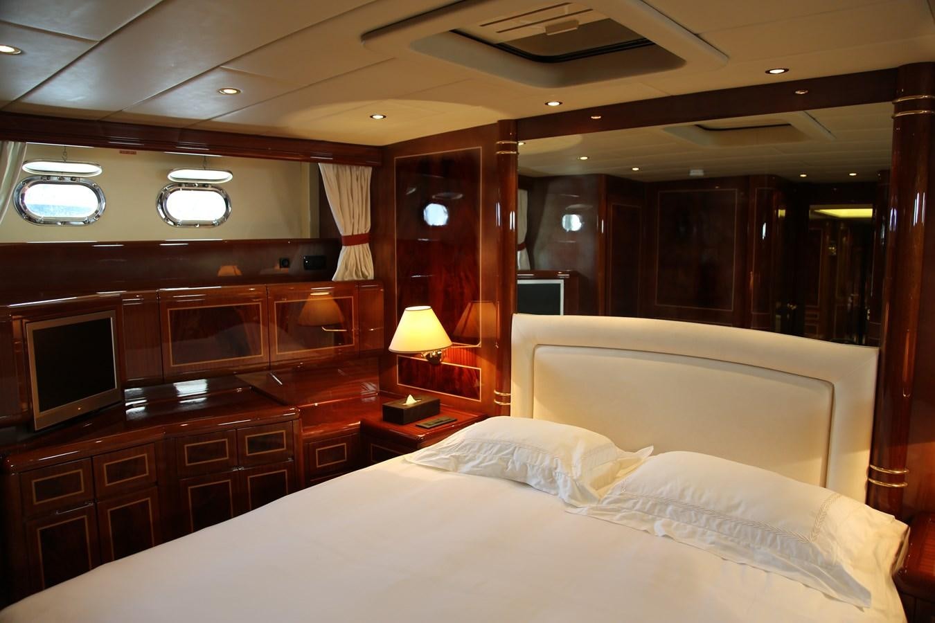 a room with a bed and a desk aboard EL VIP ONE Yacht for Sale