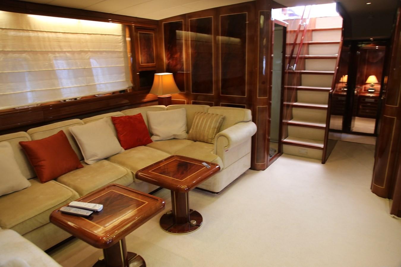 a living room with a couch and a table aboard EL VIP ONE Yacht for Sale