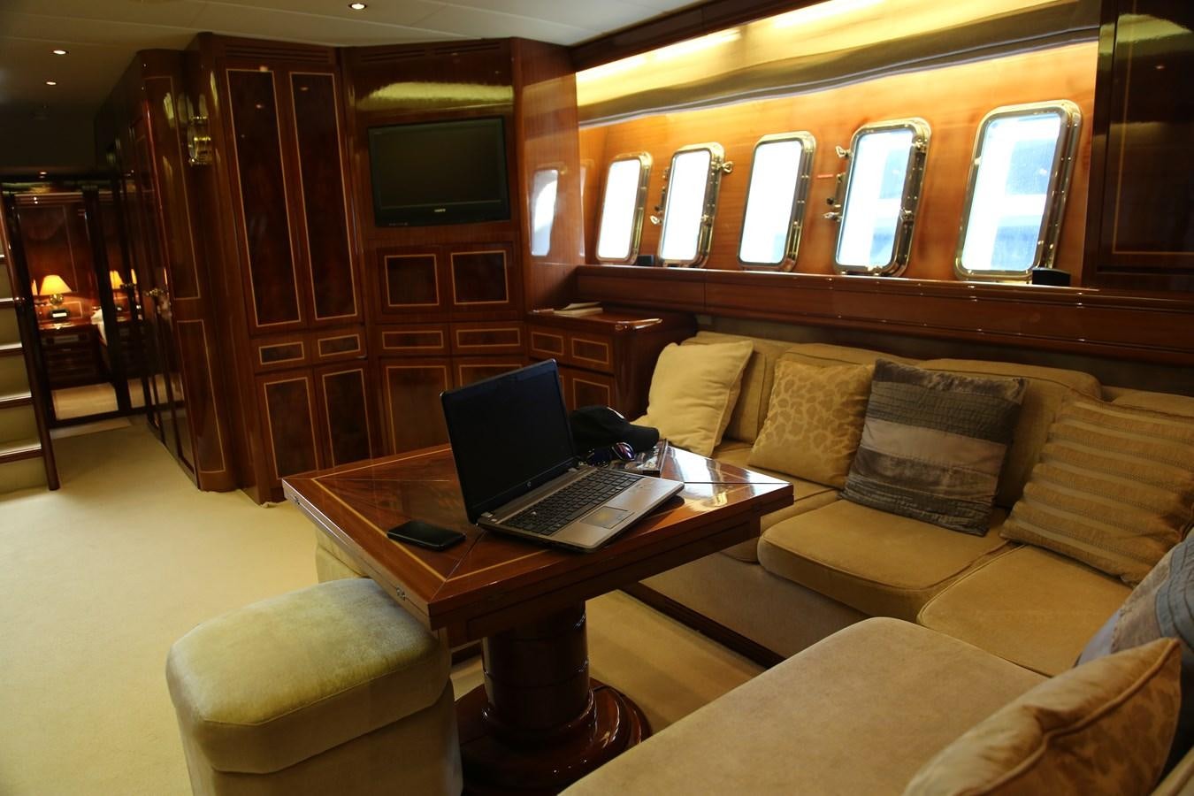 a laptop on a table aboard EL VIP ONE Yacht for Sale