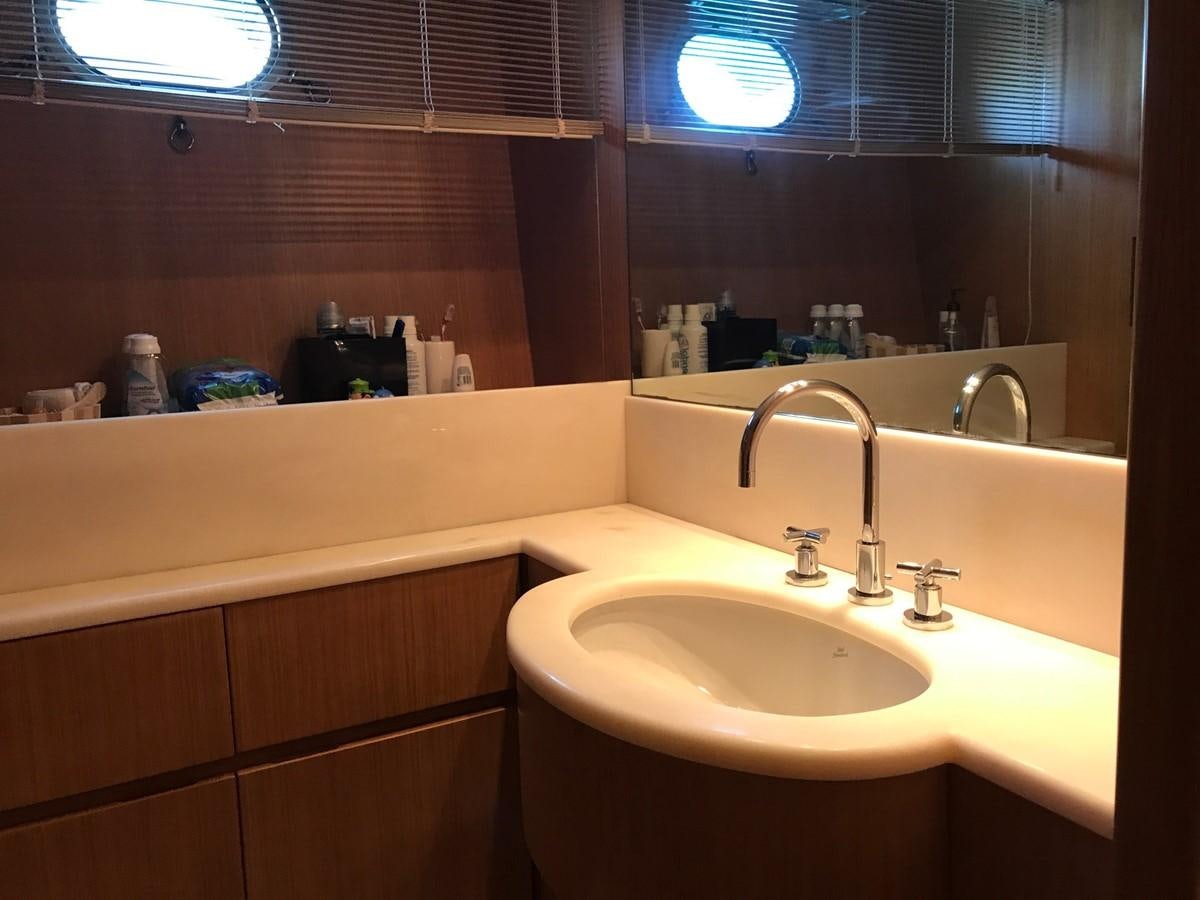a bathroom with a sink and a mirror aboard LADY LO OF LONDON Yacht for Sale