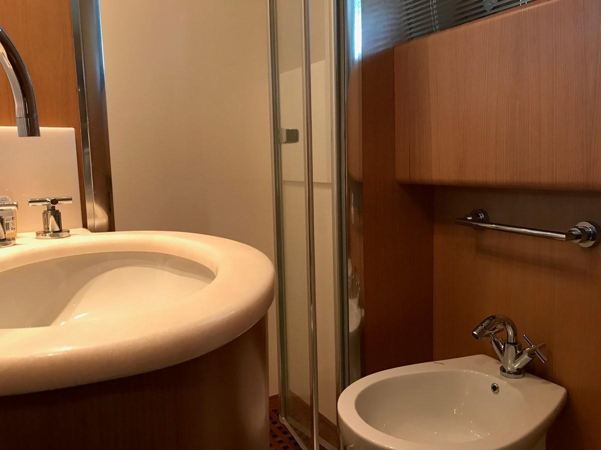 a bathroom with a sink and a mirror aboard LADY LO OF LONDON Yacht for Sale