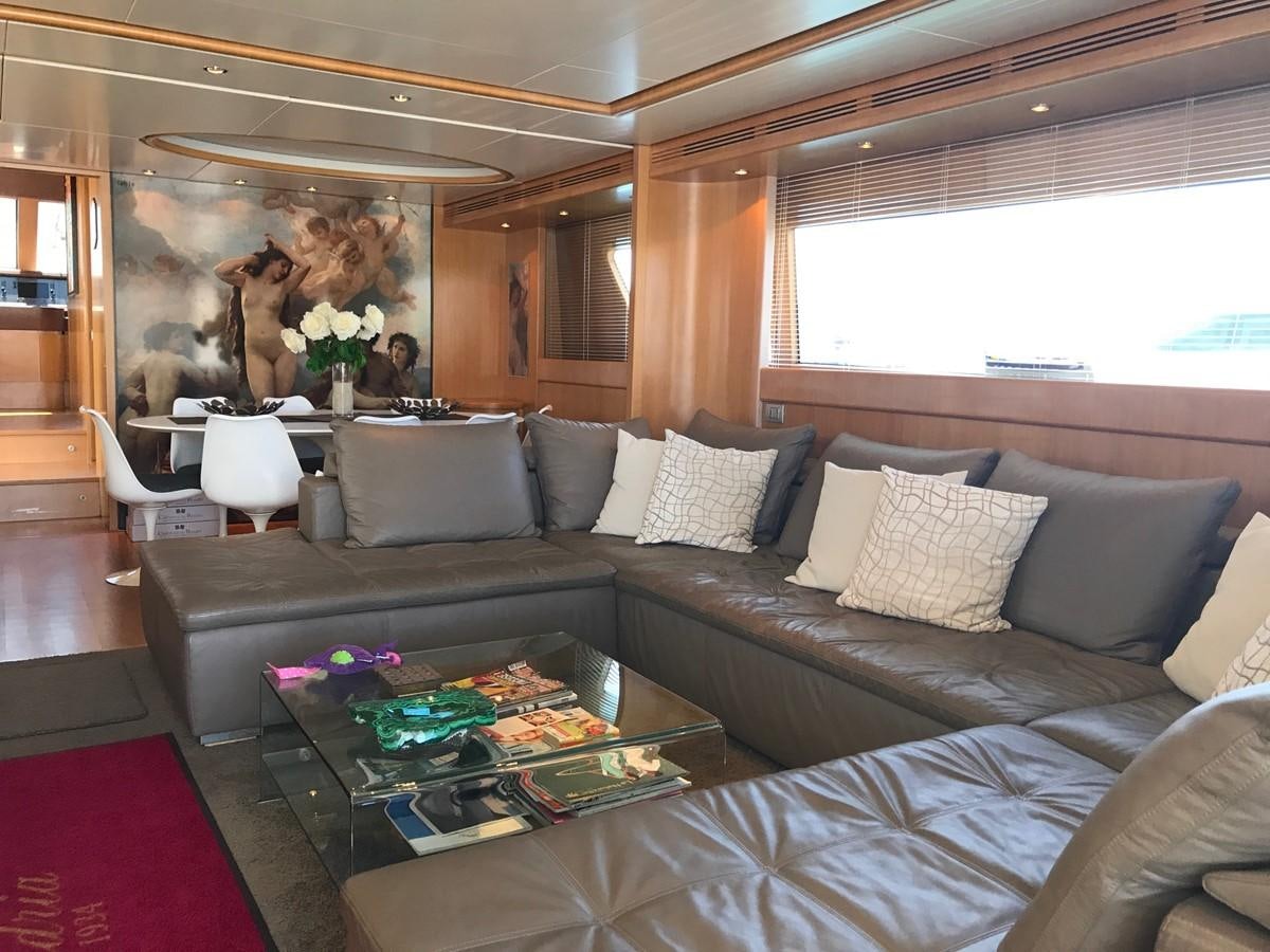 a living room with a couch and a fireplace aboard LADY LO OF LONDON Yacht for Sale
