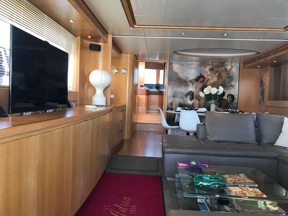 a living room with a large fireplace aboard LADY LO OF LONDON Yacht for Sale