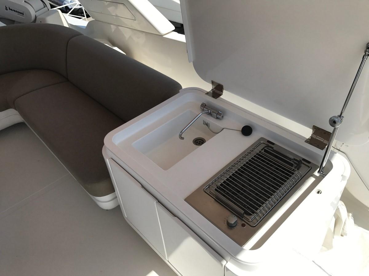 a white bathtub with a sink aboard LADY LO OF LONDON Yacht for Sale