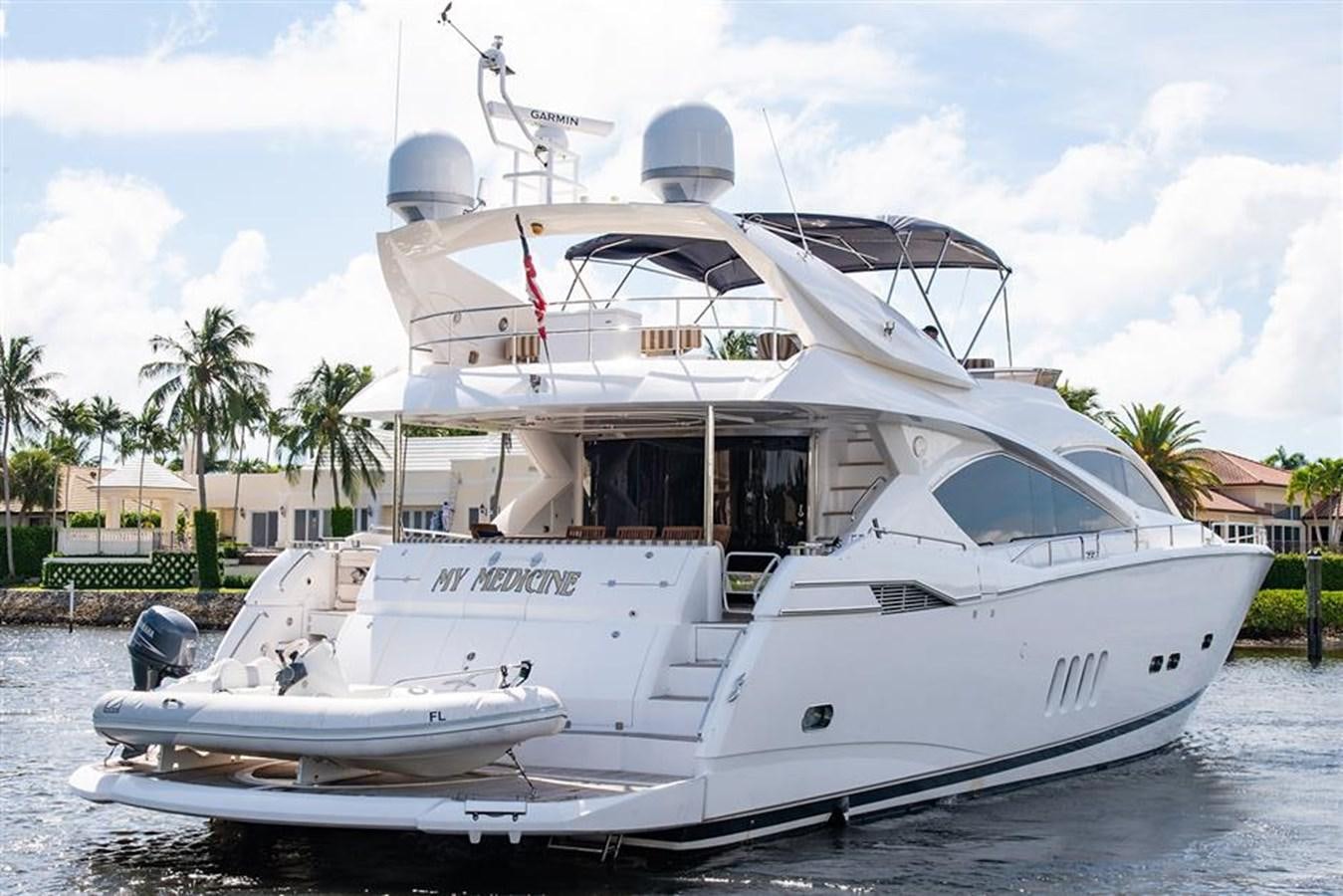 a white yacht on the water aboard MY MEDICINE Yacht for Sale