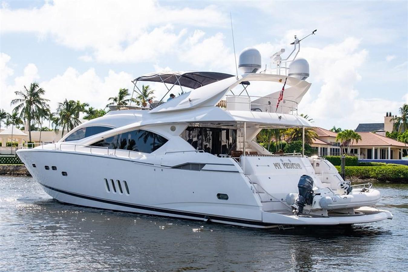 a white yacht on the water aboard MY MEDICINE Yacht for Sale