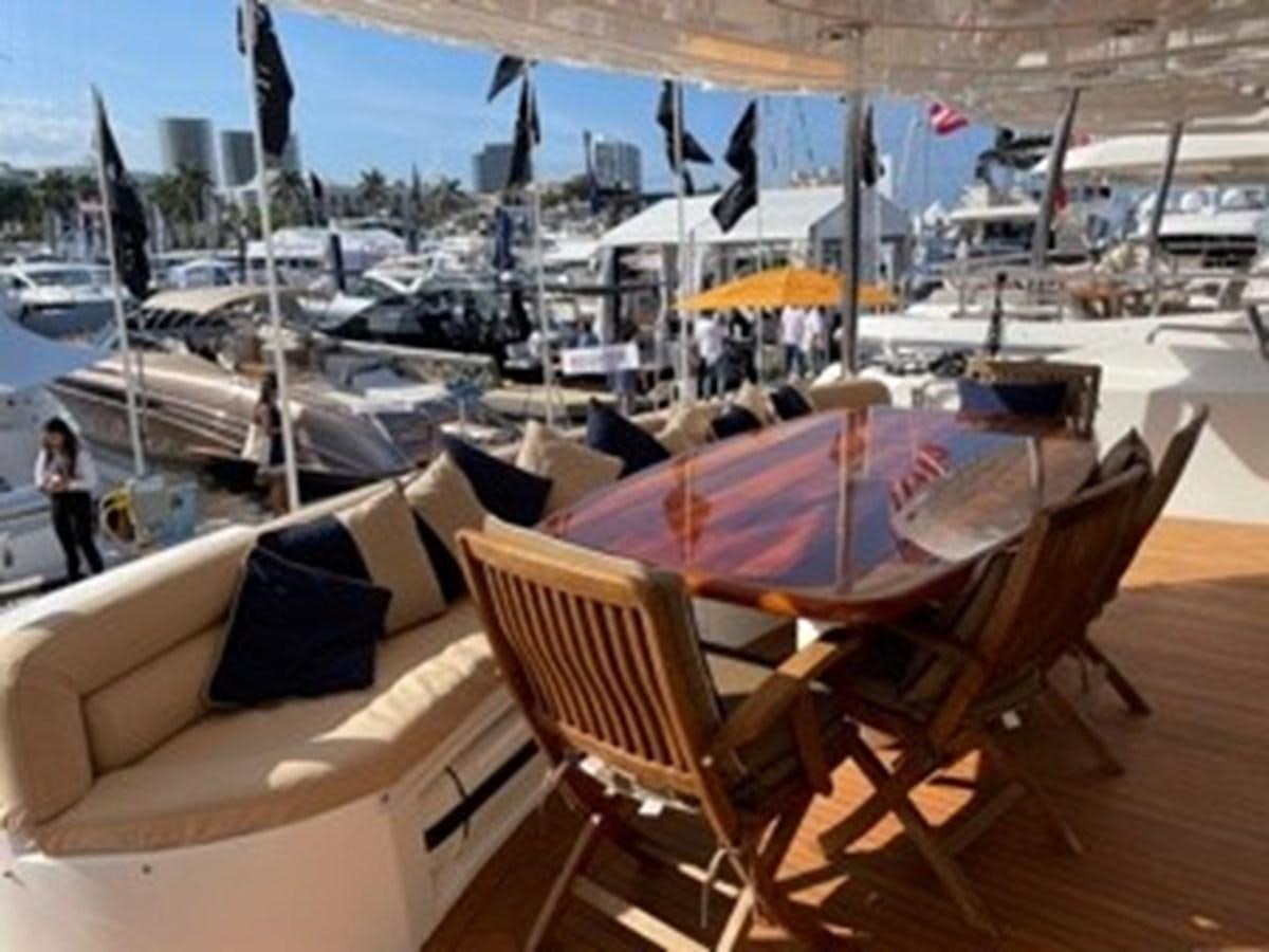 a group of chairs and tables on a beach aboard MY MEDICINE Yacht for Sale