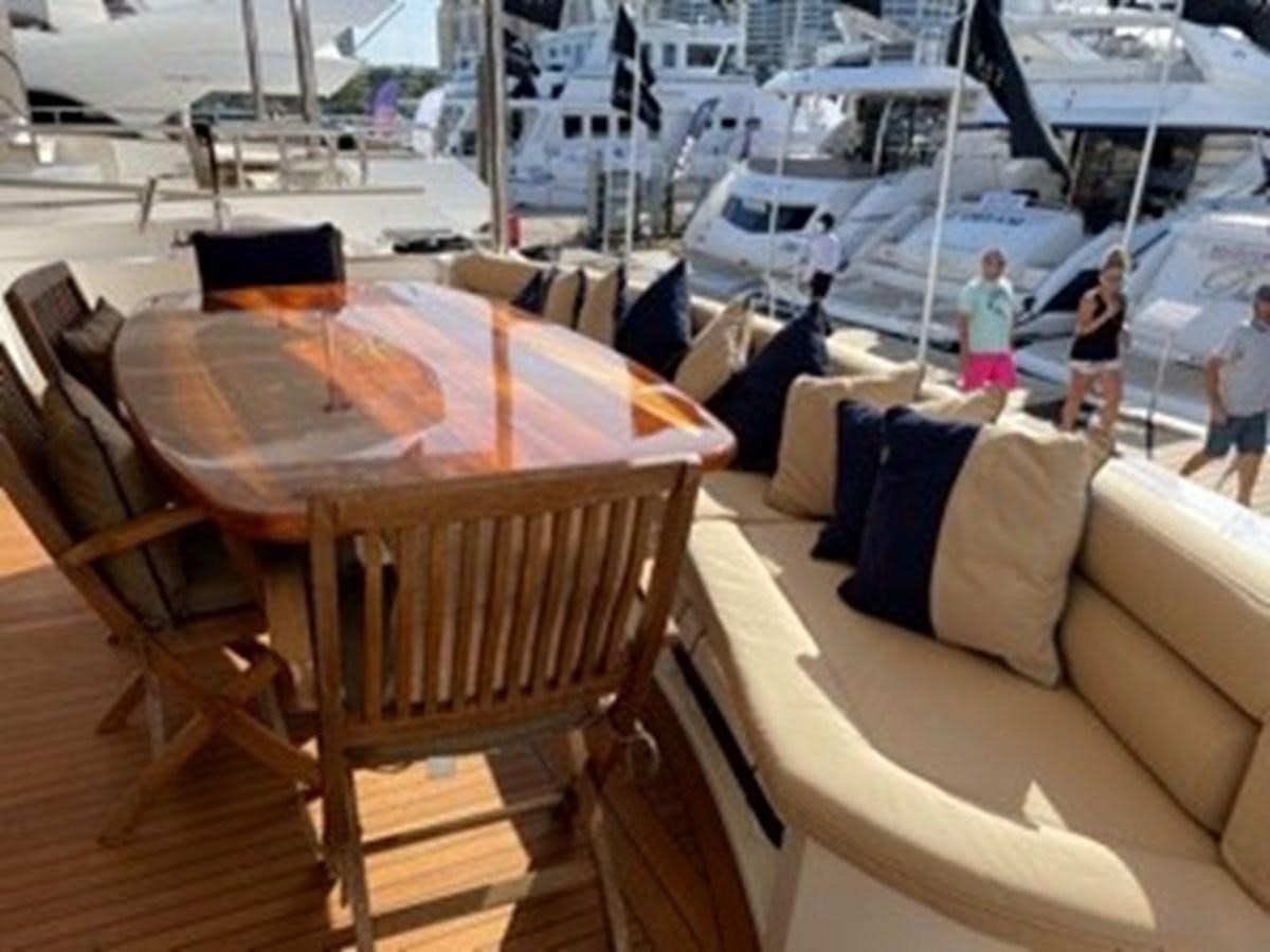 a table and chairs on a boat aboard MY MEDICINE Yacht for Sale