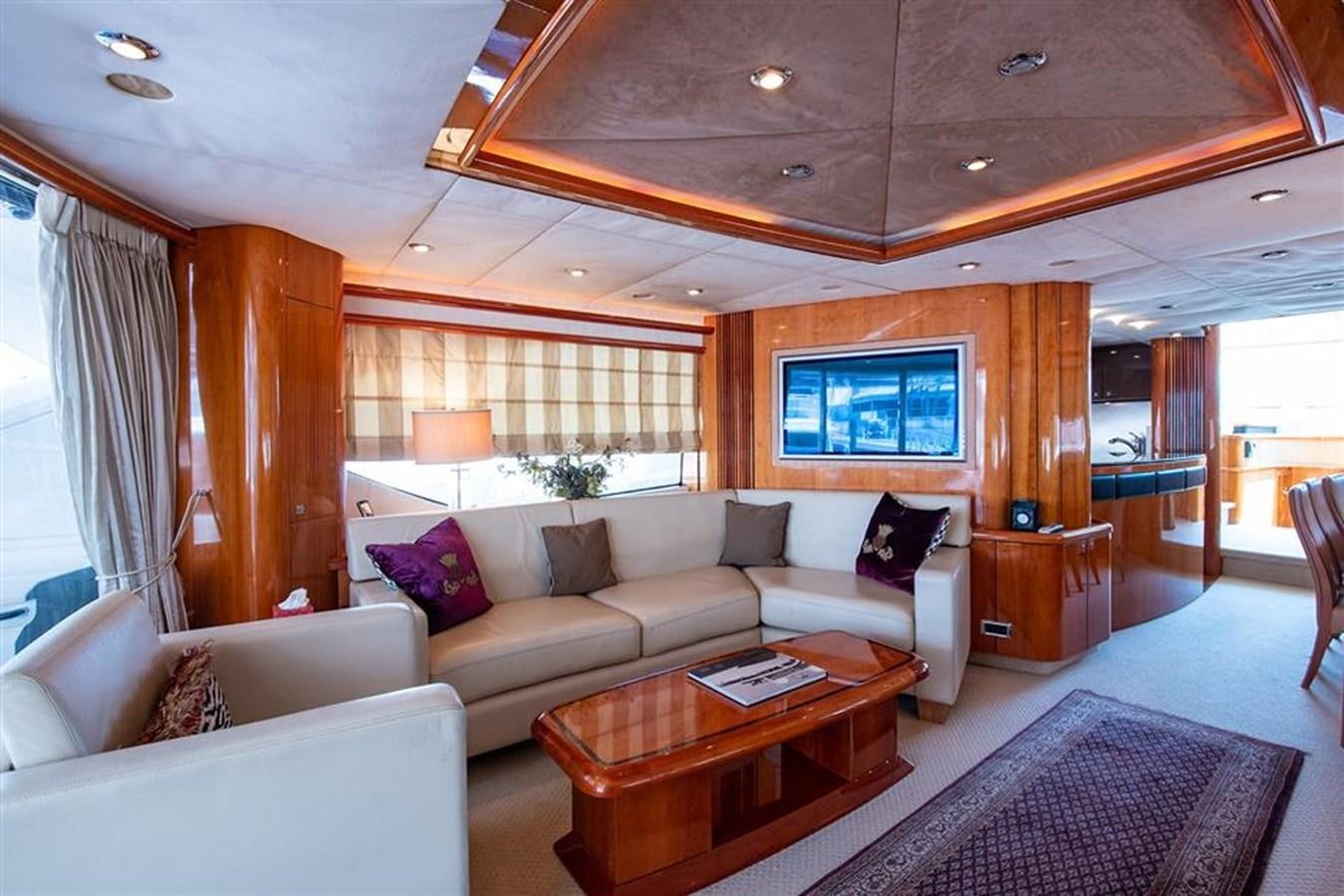 a living room with a couch and a coffee table aboard MY MEDICINE Yacht for Sale