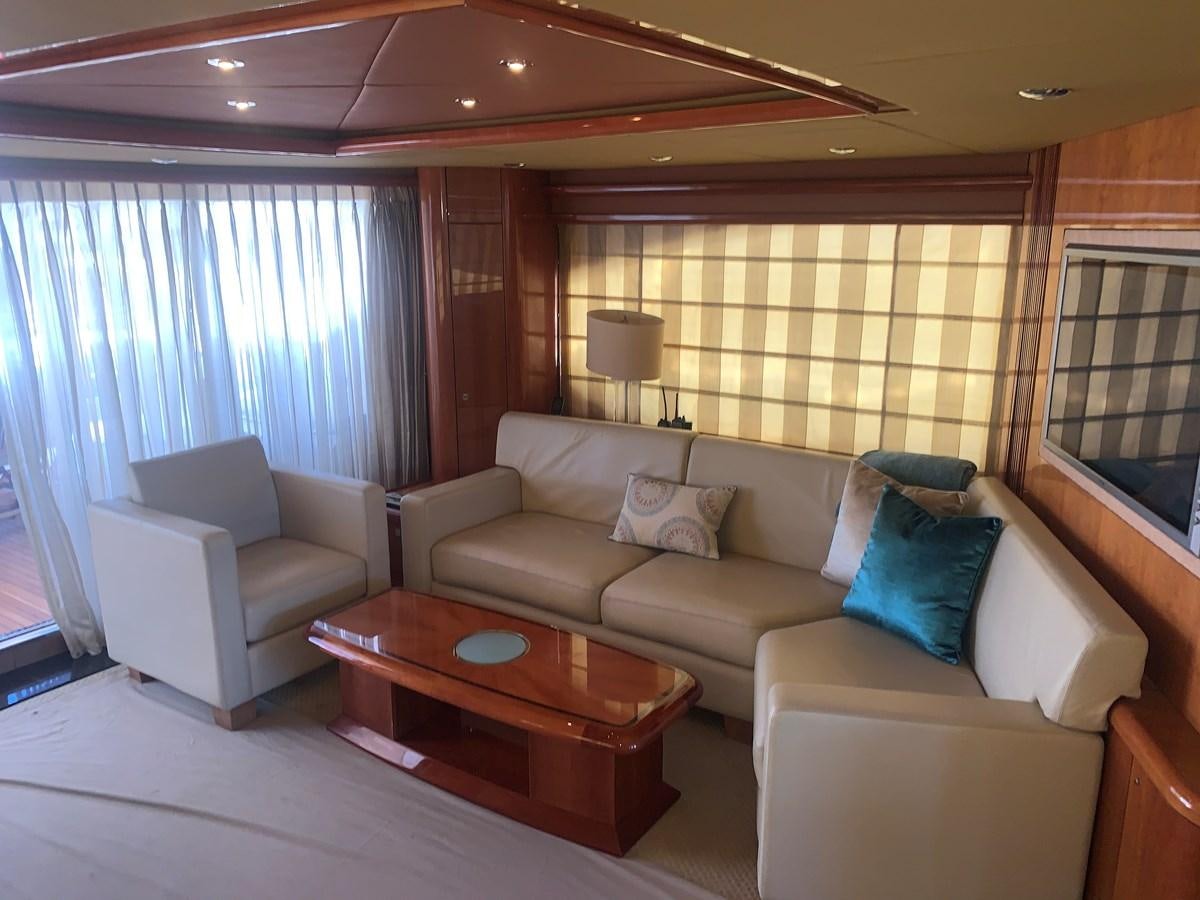 a living room with a couch and a coffee table aboard MY MEDICINE Yacht for Sale
