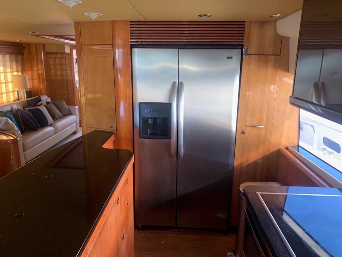 a kitchen with a stainless steel refrigerator aboard MY MEDICINE Yacht for Sale