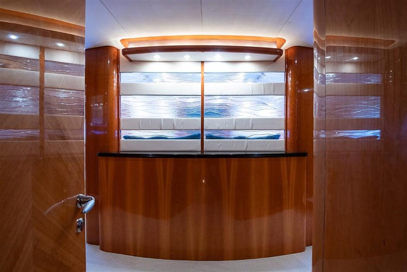 a wooden cabinet with a glass door aboard MY MEDICINE Yacht for Sale