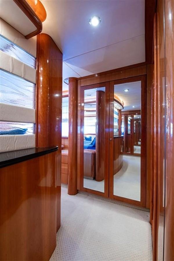a hallway with glass doors aboard MY MEDICINE Yacht for Sale