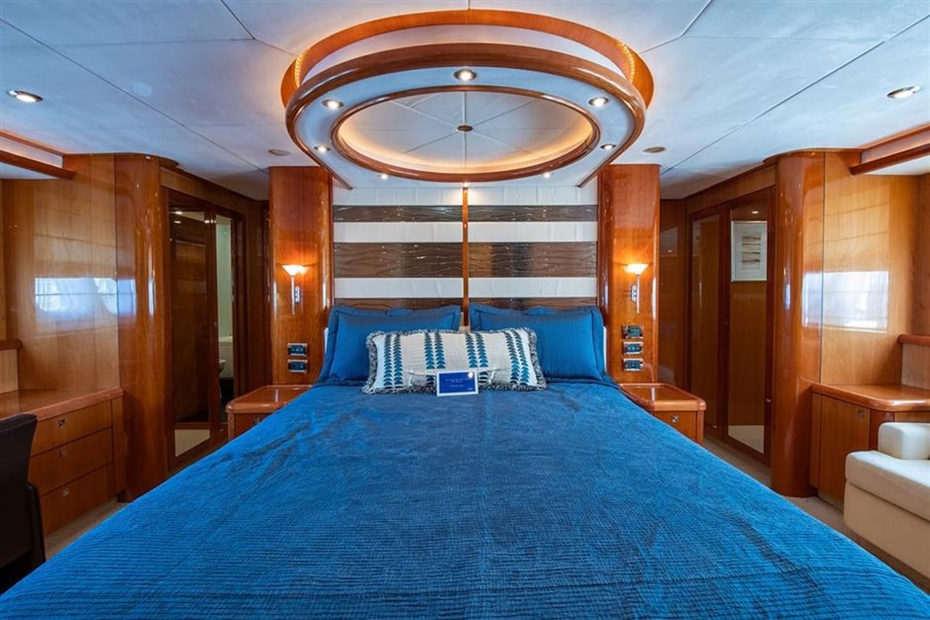a bed with a blue sheet aboard MY MEDICINE Yacht for Sale
