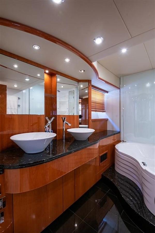 a bathroom with sinks and a large mirror aboard MY MEDICINE Yacht for Sale