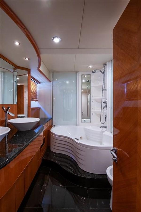 a bathroom with a tub sink and a sink aboard MY MEDICINE Yacht for Sale