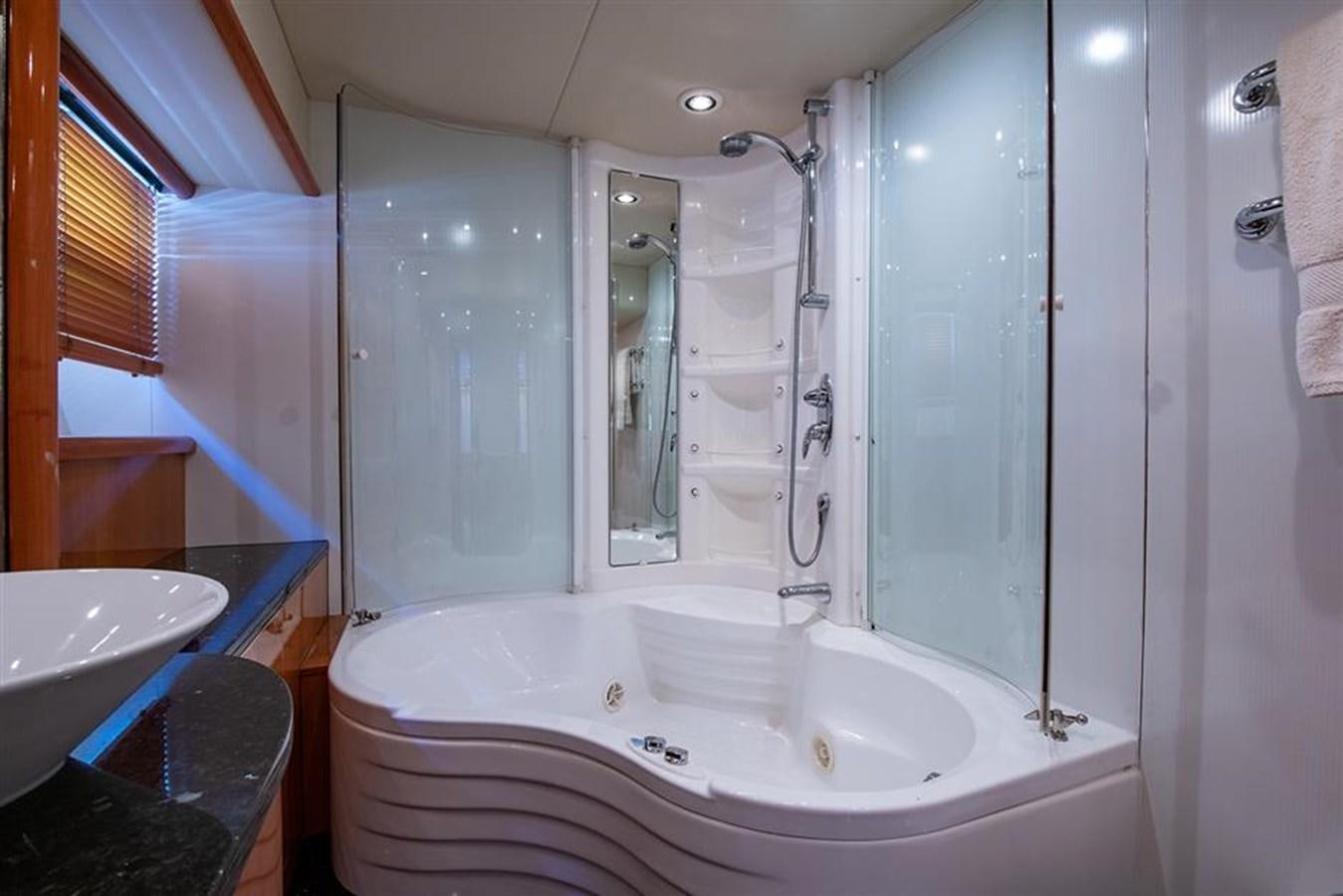 a bathroom with a bathtub and sink aboard MY MEDICINE Yacht for Sale