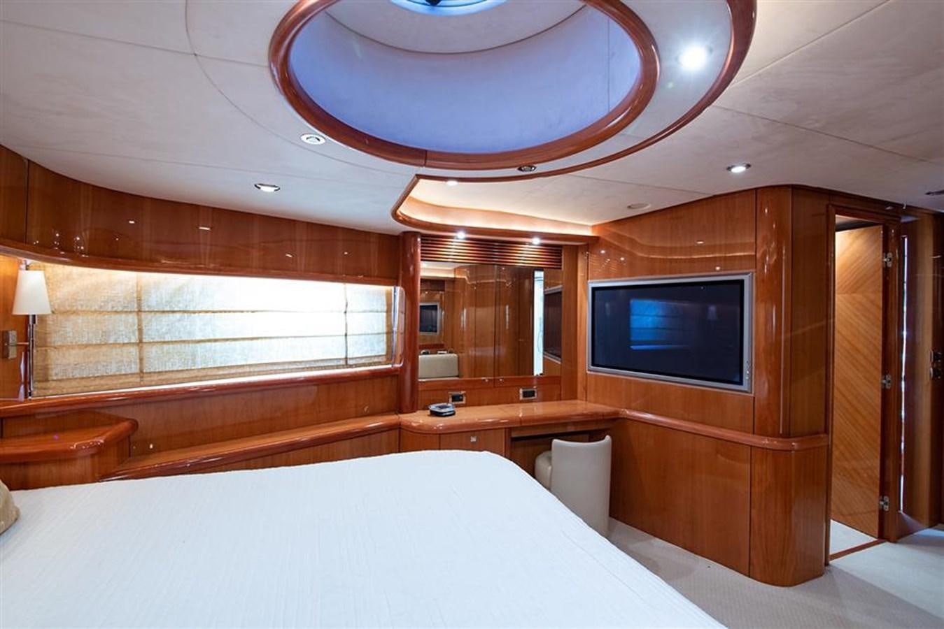 a room with a bed and a television aboard MY MEDICINE Yacht for Sale