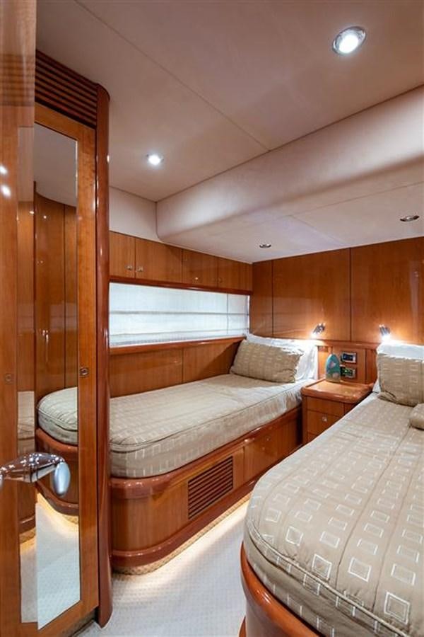 a bedroom with a bed and a closet aboard MY MEDICINE Yacht for Sale