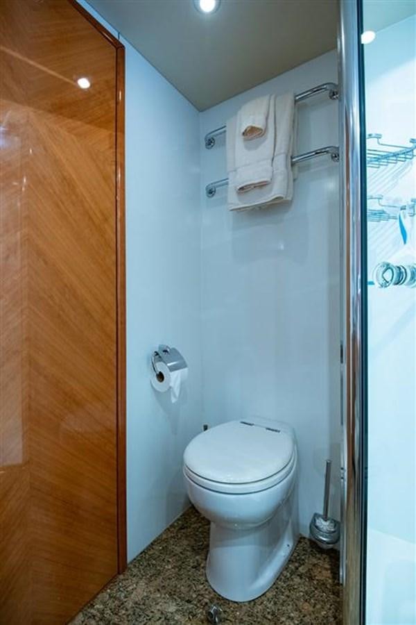 a toilet in a bathroom aboard MY MEDICINE Yacht for Sale