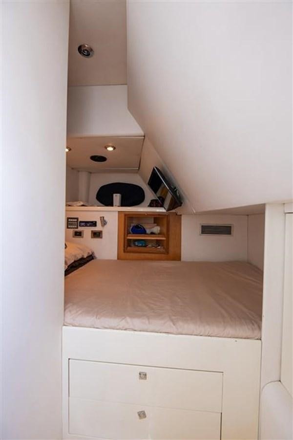 a bedroom with a bed and a shelf aboard MY MEDICINE Yacht for Sale