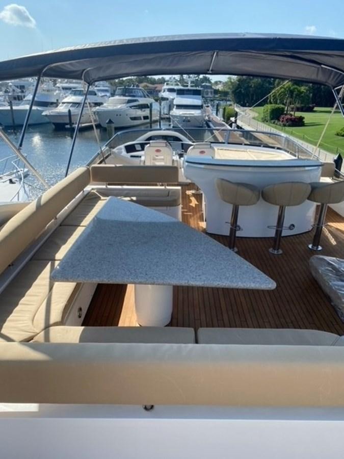 a table with chairs on it aboard MY MEDICINE Yacht for Sale