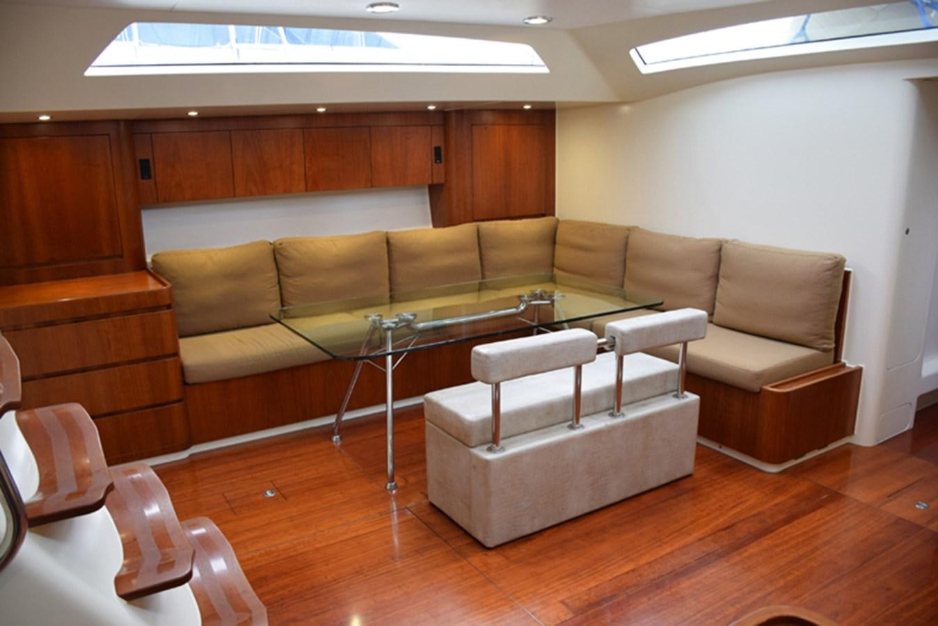 a living room with a couch and a coffee table aboard WHITE DUMBO Yacht for Sale
