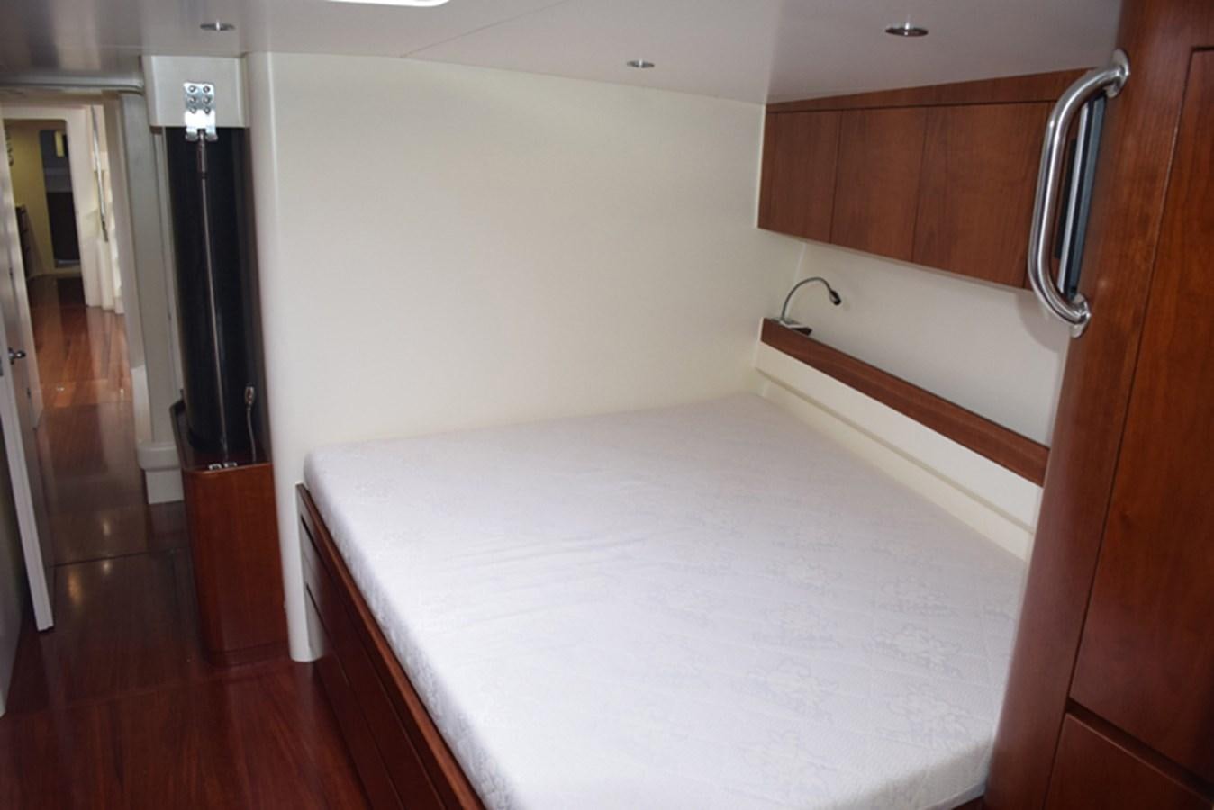 a bed in a room aboard WHITE DUMBO Yacht for Sale