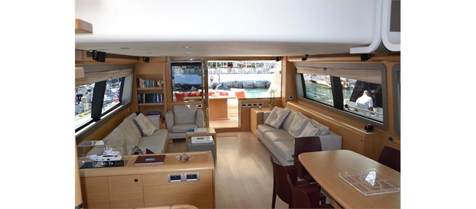 a living room with a large window aboard LA STELLA Yacht for Sale