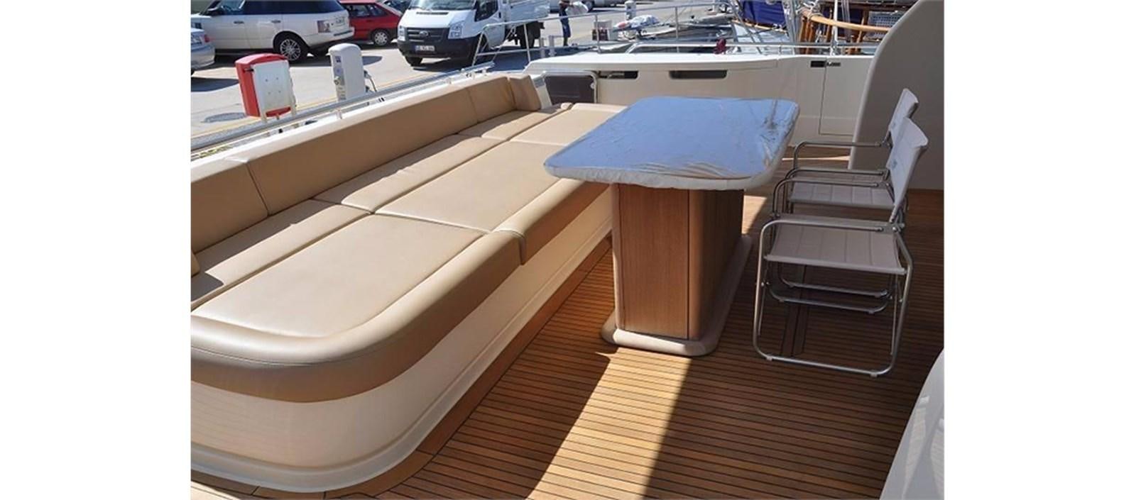 a chair on a deck aboard LA STELLA Yacht for Sale