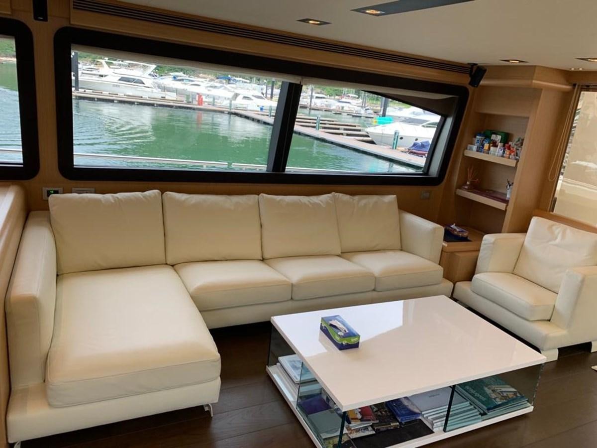 a living room with a large window aboard FERRETTI F800/27 Yacht for Sale