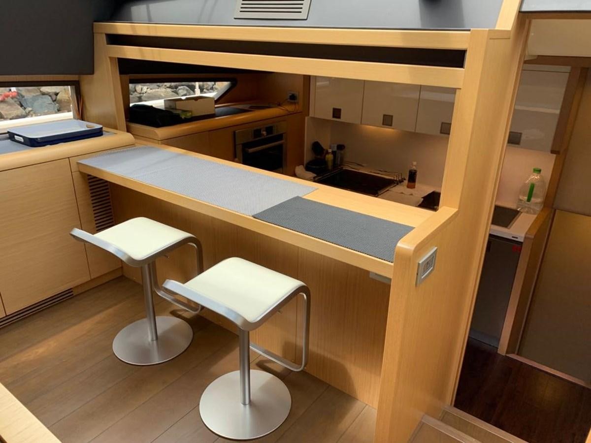 a desk with stools and a sink aboard FERRETTI F800/27 Yacht for Sale