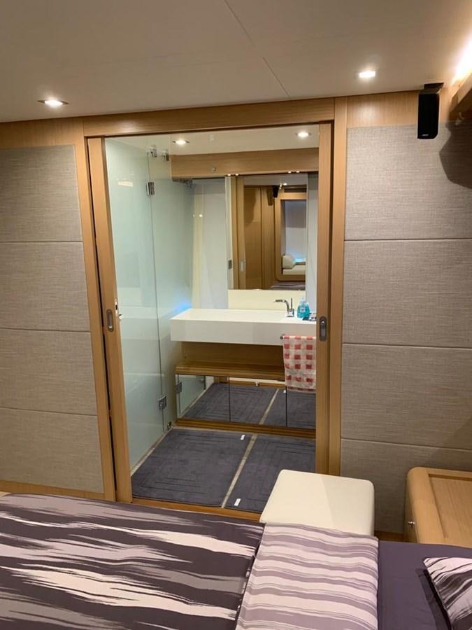 a bathroom with a large mirror aboard FERRETTI F800/27 Yacht for Sale
