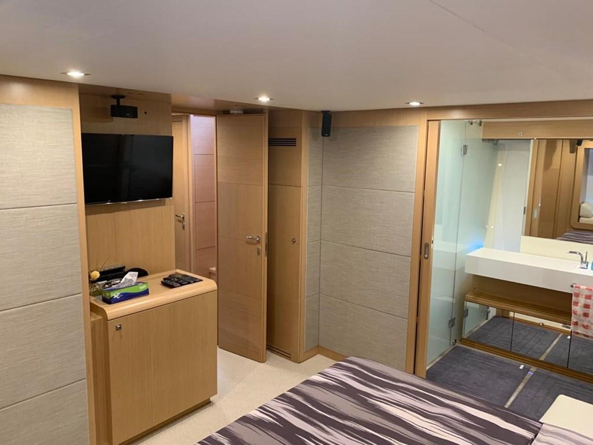 a room with a bed and a desk aboard FERRETTI F800/27 Yacht for Sale