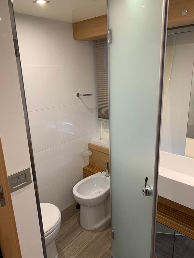 a bathroom with a toilet and a sink aboard FERRETTI F800/27 Yacht for Sale