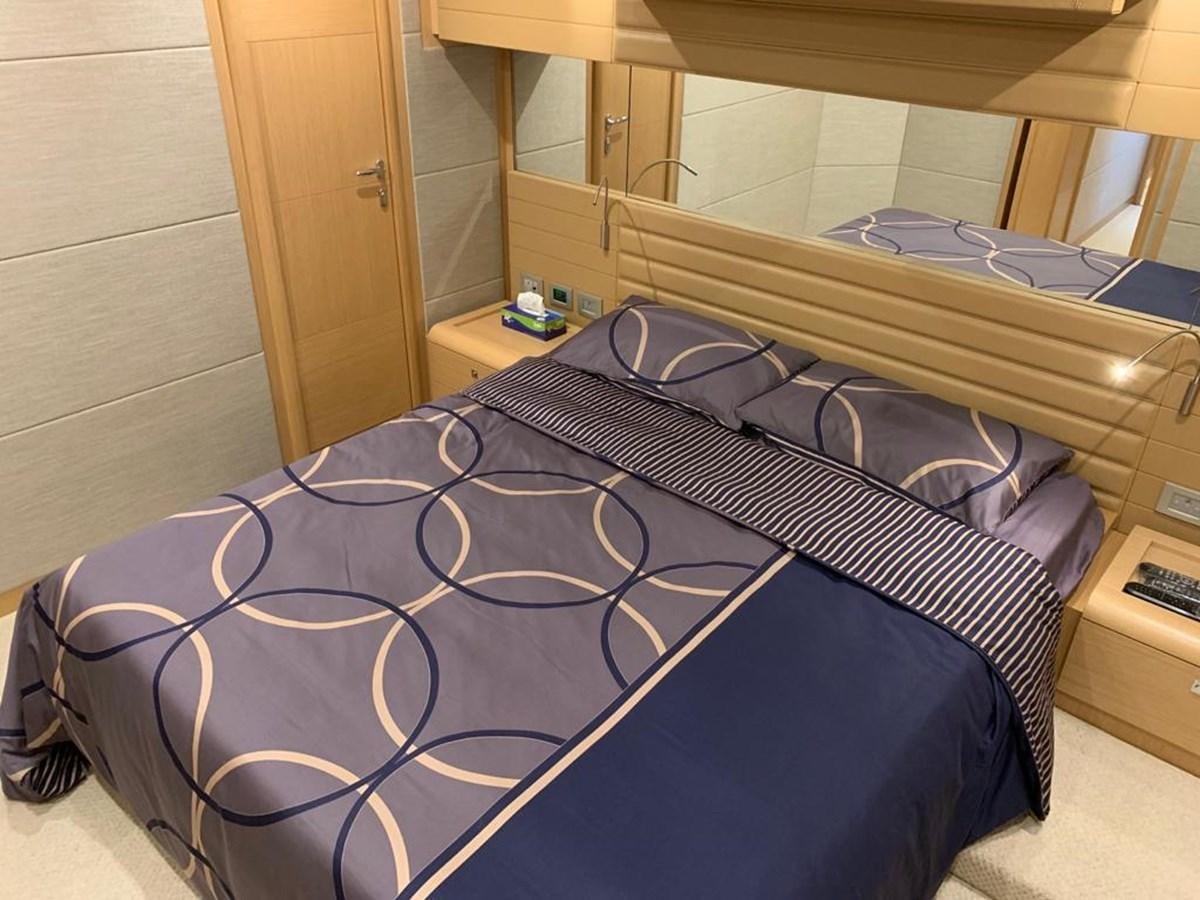 a bed in a room aboard FERRETTI F800/27 Yacht for Sale