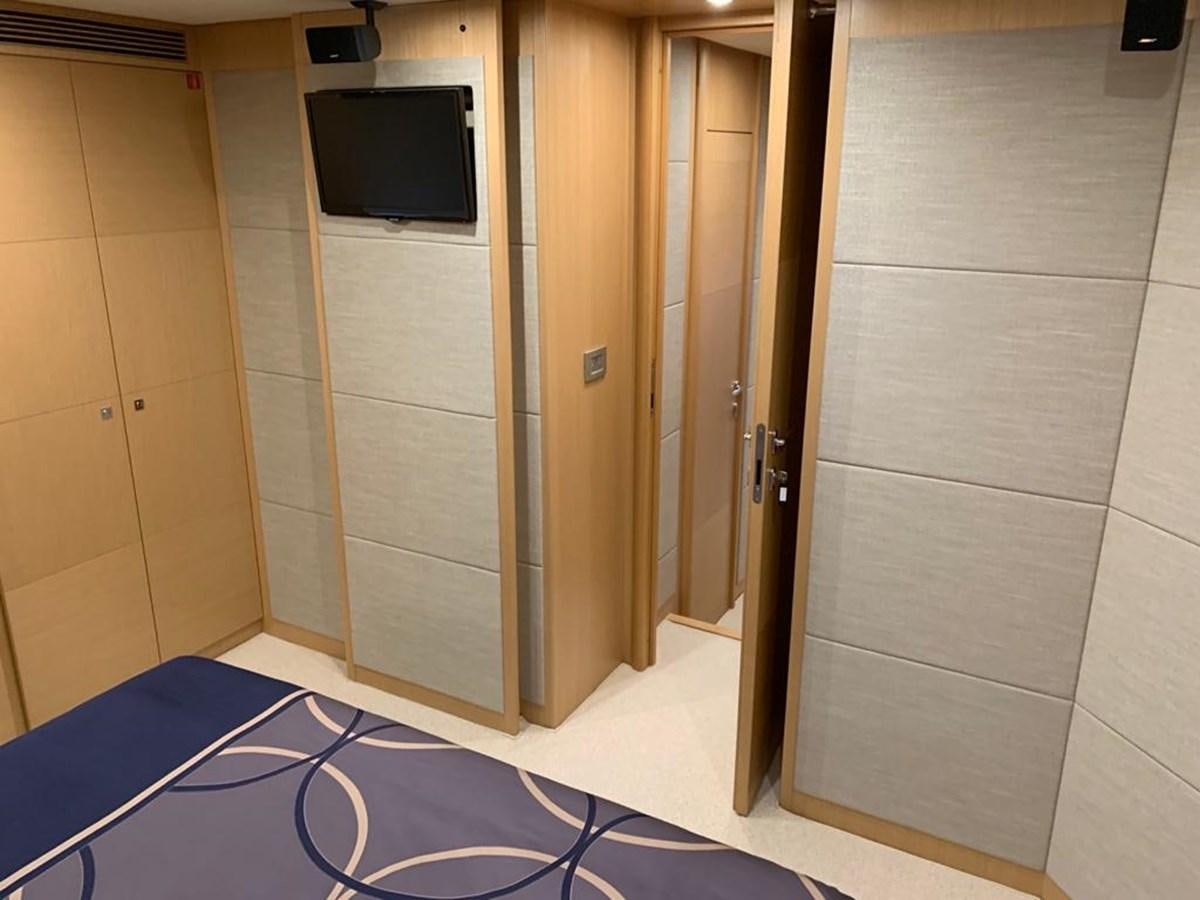 a room with a tv and a door aboard FERRETTI F800/27 Yacht for Sale