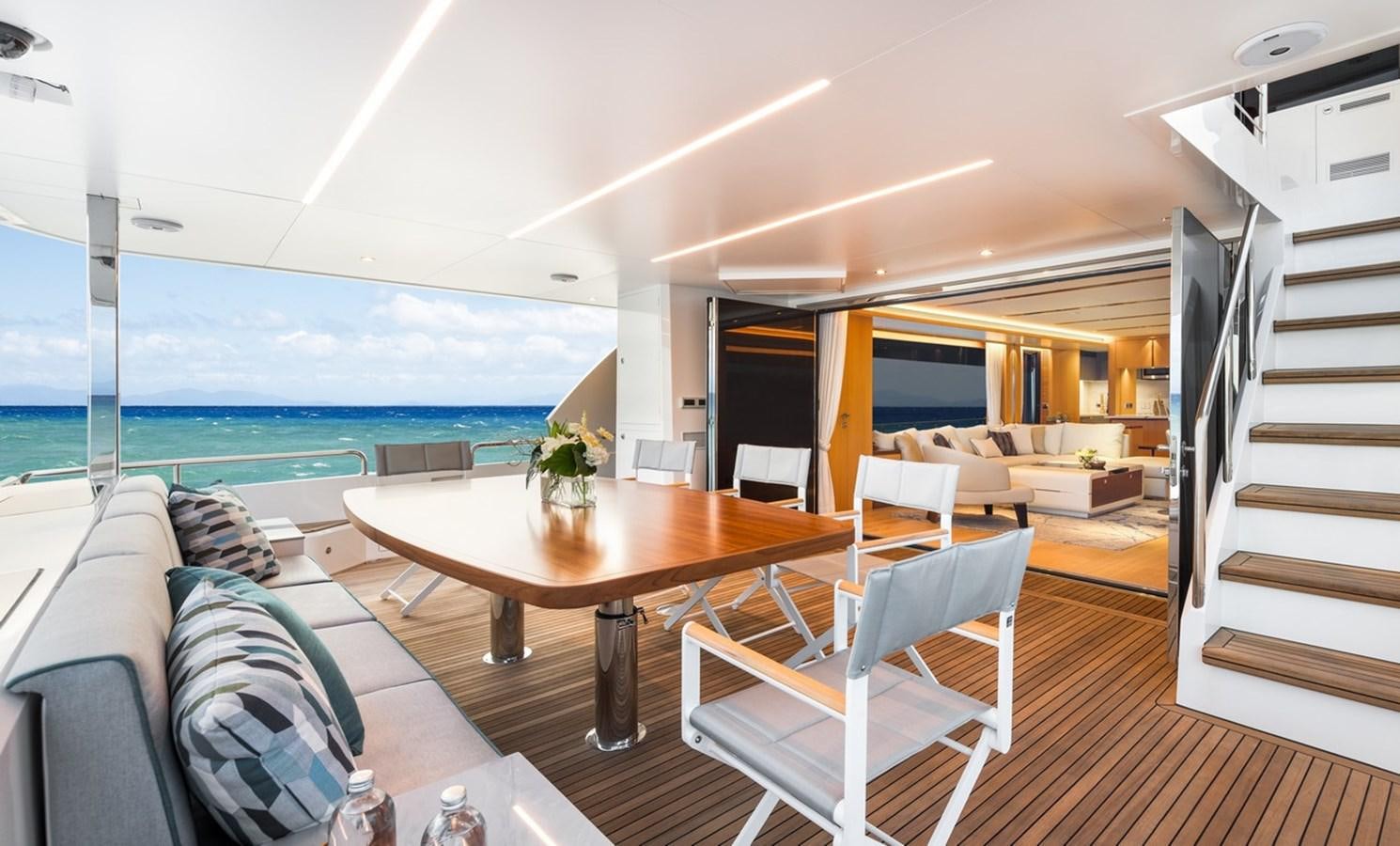 a living room with a table and chairs aboard FD80 SKYLINE (NEW BOAT SPEC ) Yacht for Sale