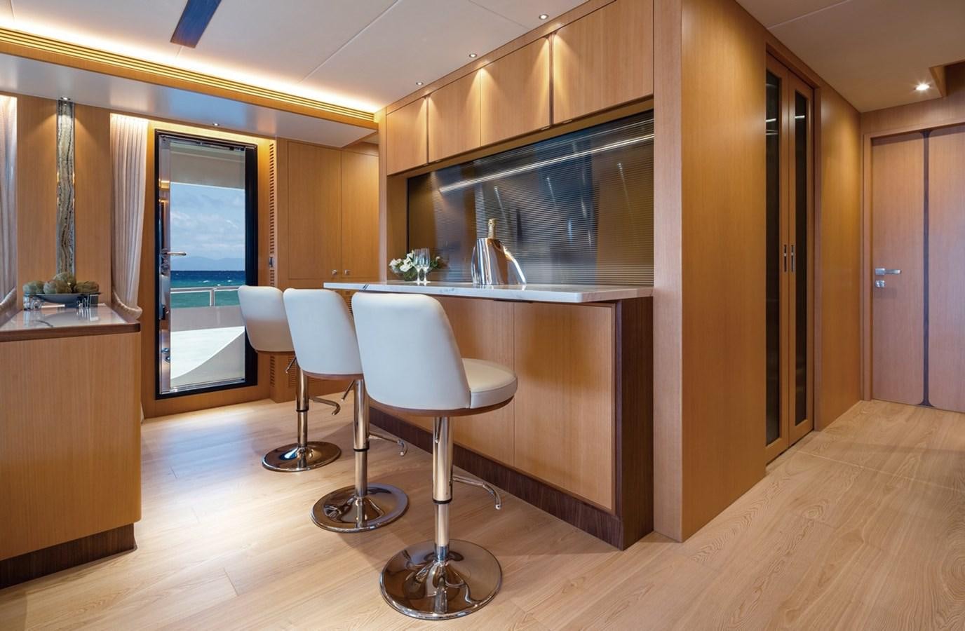 a kitchen with a table and chairs aboard FD80 SKYLINE (NEW BOAT SPEC ) Yacht for Sale